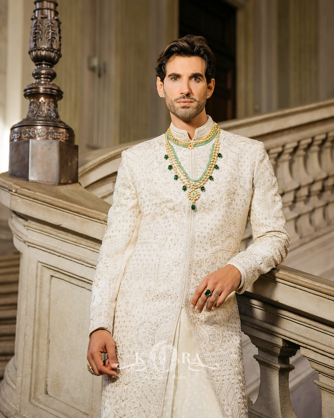 An ivory sherwani layered with heritage jewellery