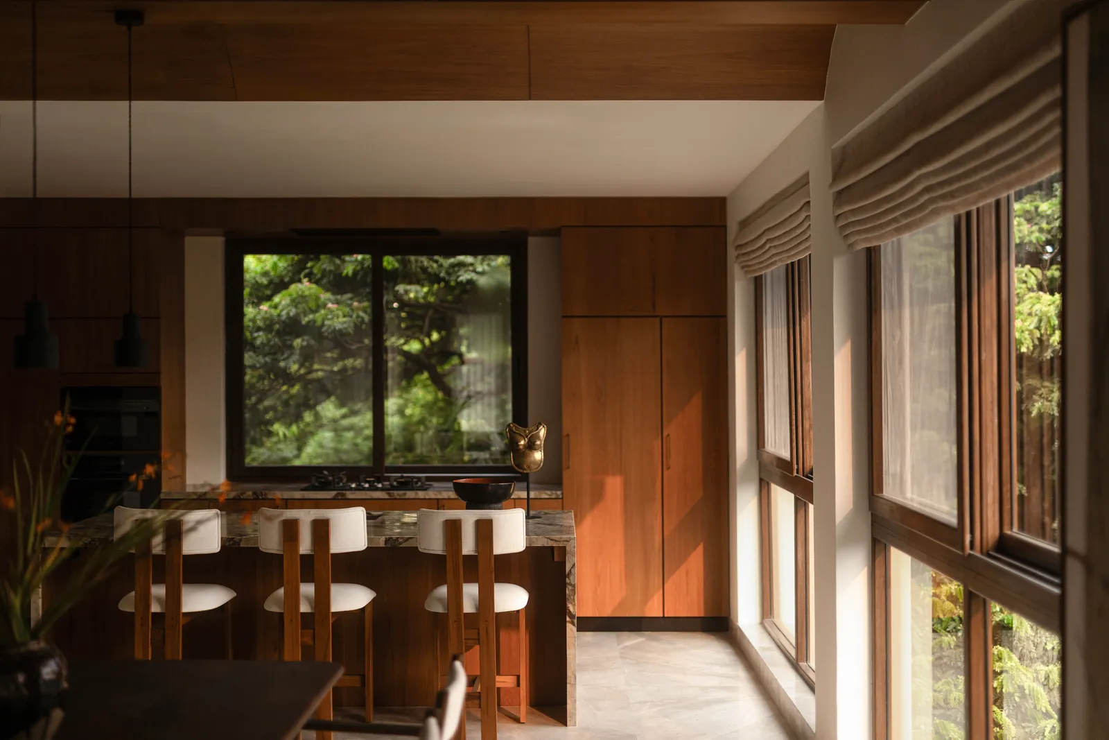 The dining nook framed by riverfront windows