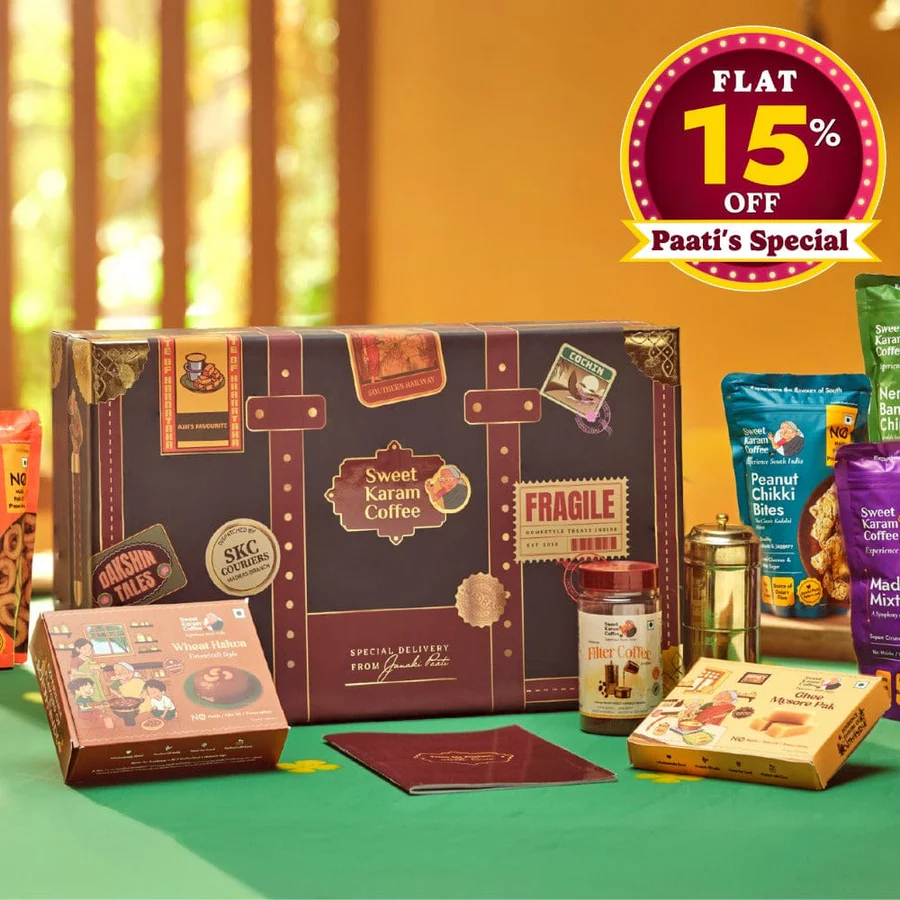 Sweet Karam Coffee Classic Dakshin Tales gift hamper box with snacks arranged around it