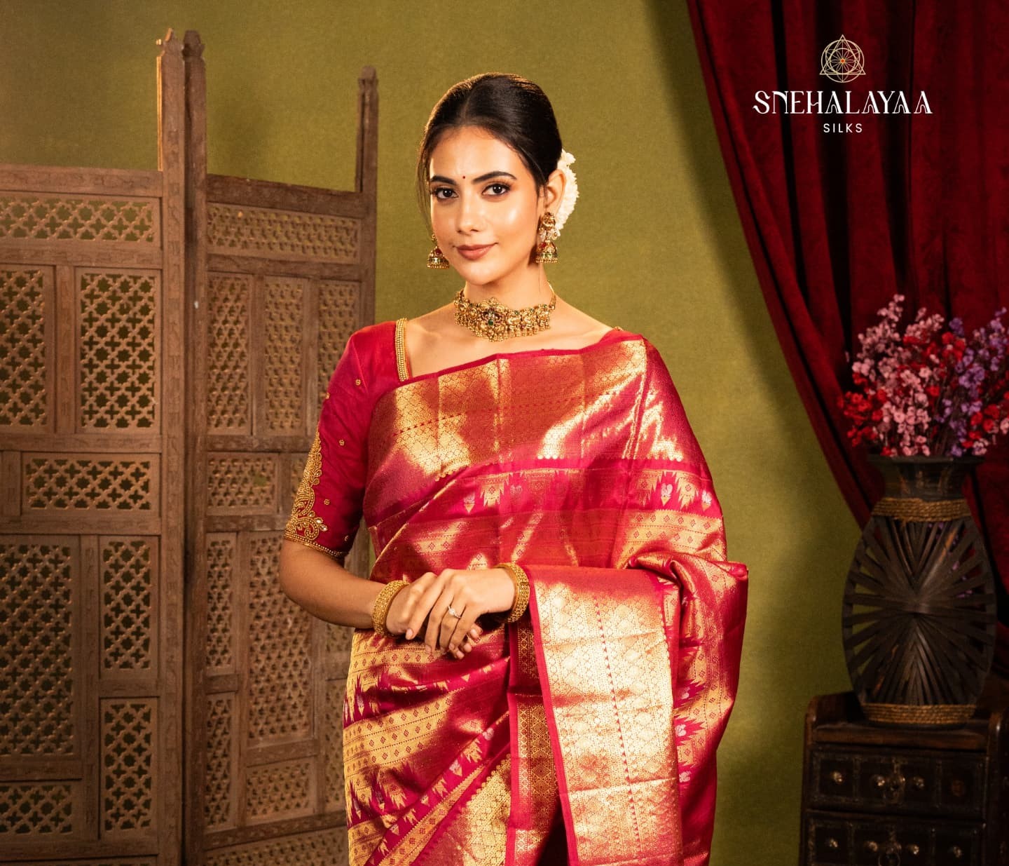 The Kanchipuram silk saree in classic red and gold