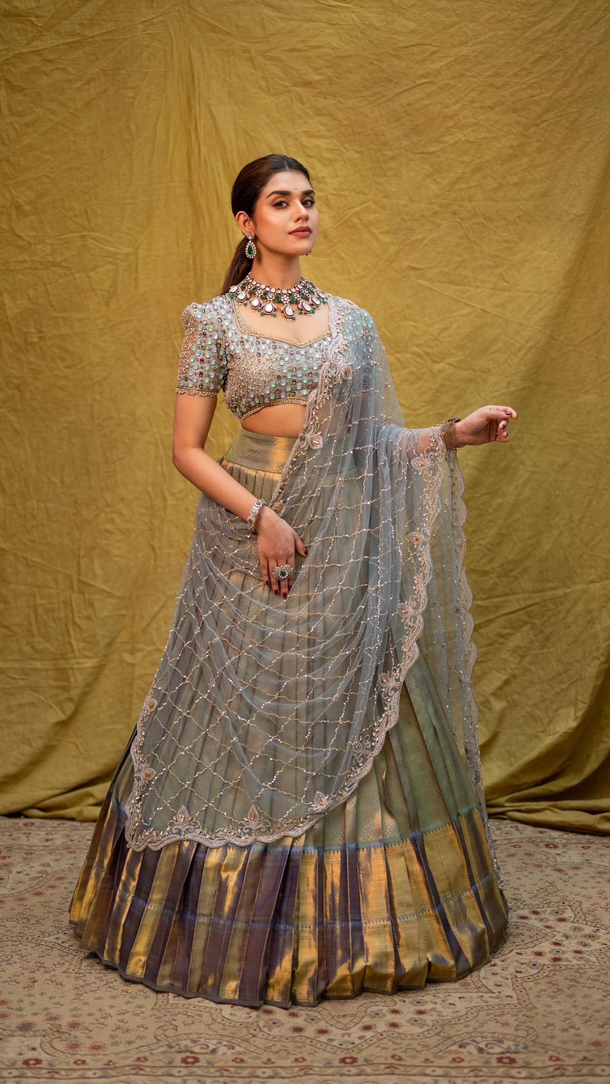 Drapes in silver and gold zari