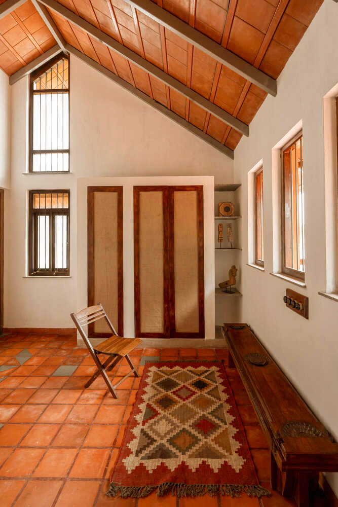 A vaulted upper room open to the roof's woodwork
