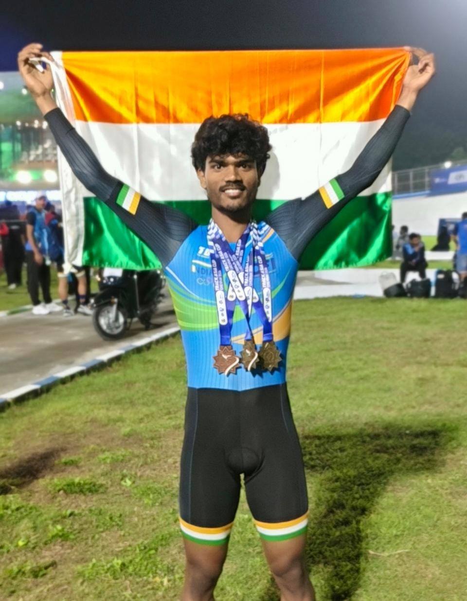 An Indian rider celebrates with the tricolour