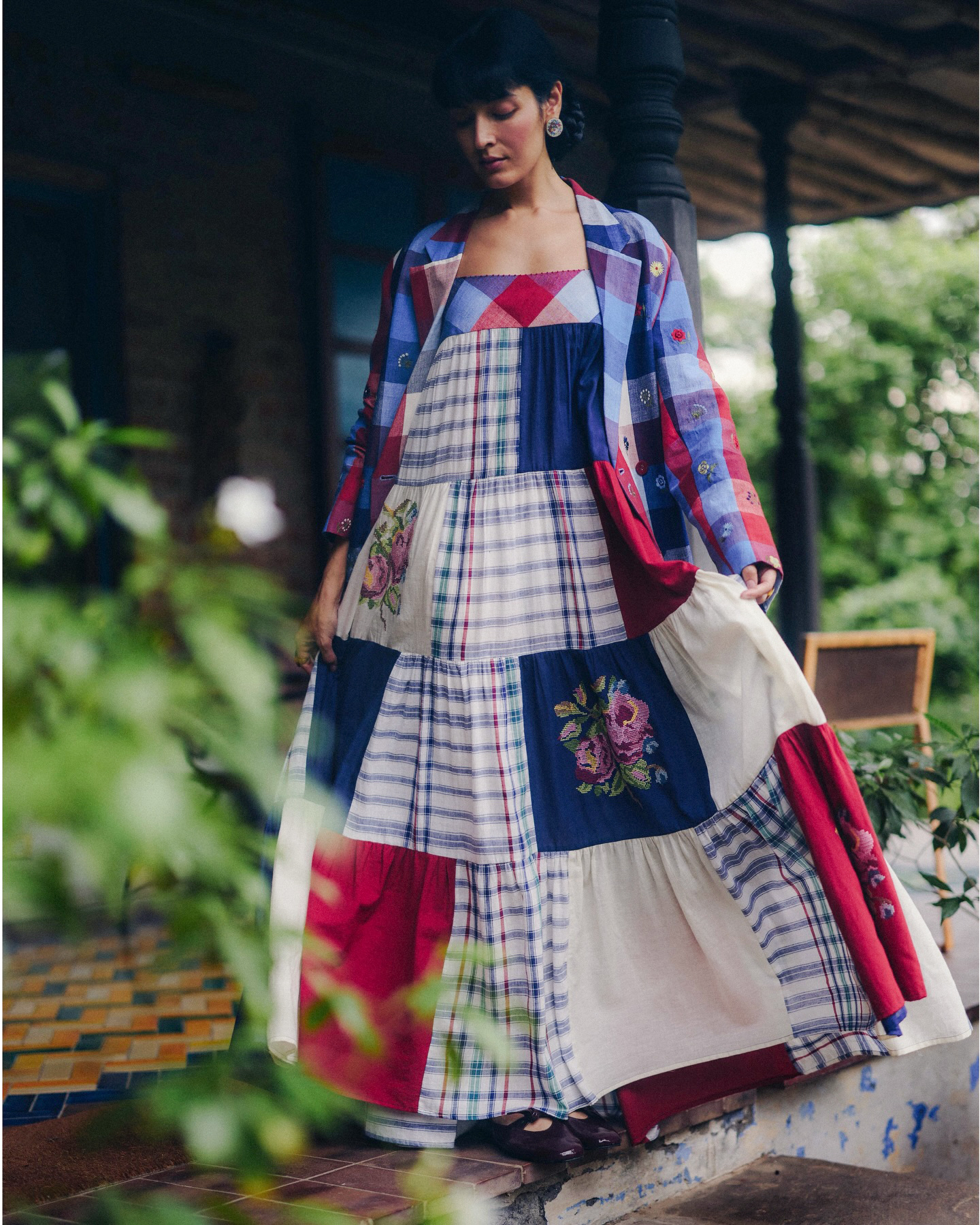 Patchwork checks and floral appliqué in a flowing silhouette