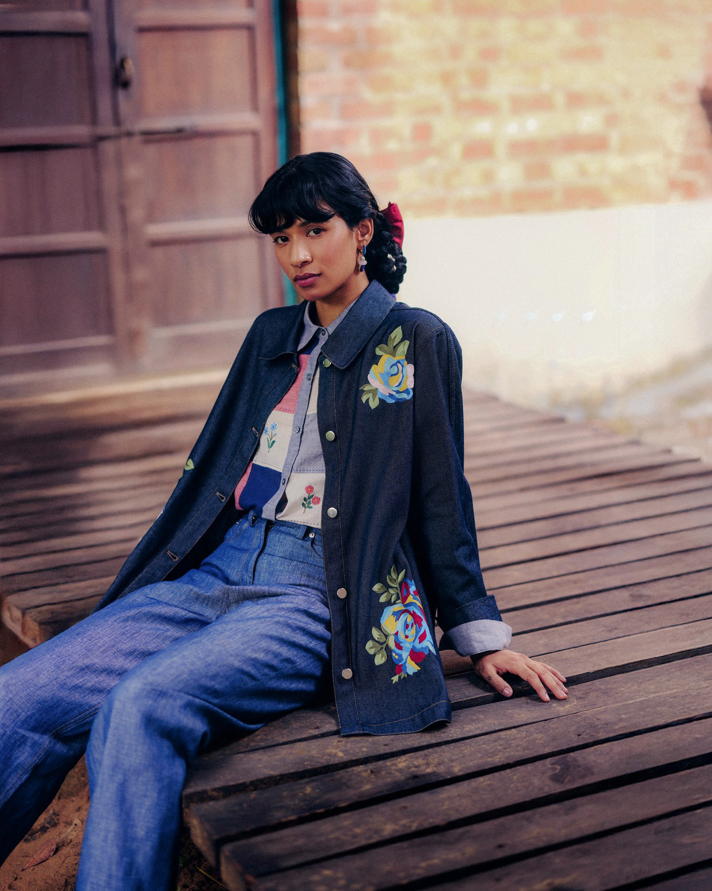 Embroidered denim, a signature of the label's poetic tailoring